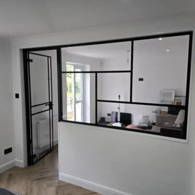 Glass Door and WIndow enclosing Living Room