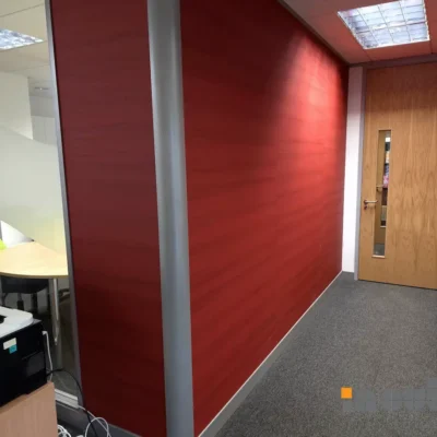 Solid partition wall with timber doors.
