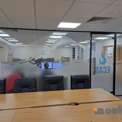 Aluminium-framed glass office partition with decorative frosted design in Hull meeting room