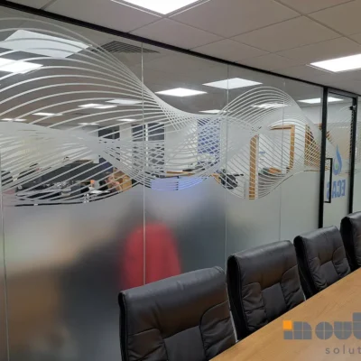 Aluminium-framed glass office partition with frosted wave design in Birmingham meeting room