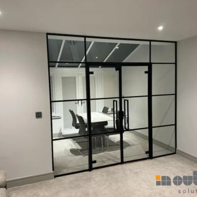 Glass Doors, Bespoke Glass Doors, Bespoke Internal Glass Doors, Black Framed Glass Doors, Glass Home Dividers, Aluminium Glazed Doors, Glass Doors, Glass Screen Divider, Internal Glass Door, Made to Measure Glass Doors, Black Glass Doors Internal, Black-framed glass partition wall and interior glass doors enclosing a meeting room