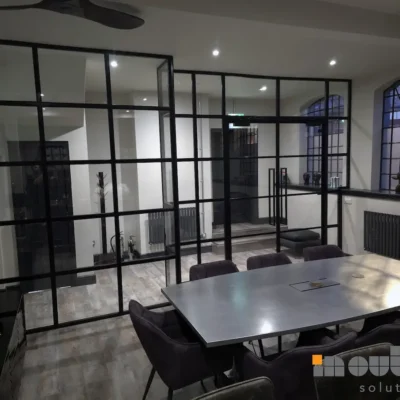 Framed glass partition enclosing a boardroom meeting space in Birmingham office