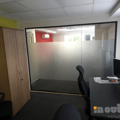 Frosted glass office divider in Nottingham separating a private meeting room from the main workspace